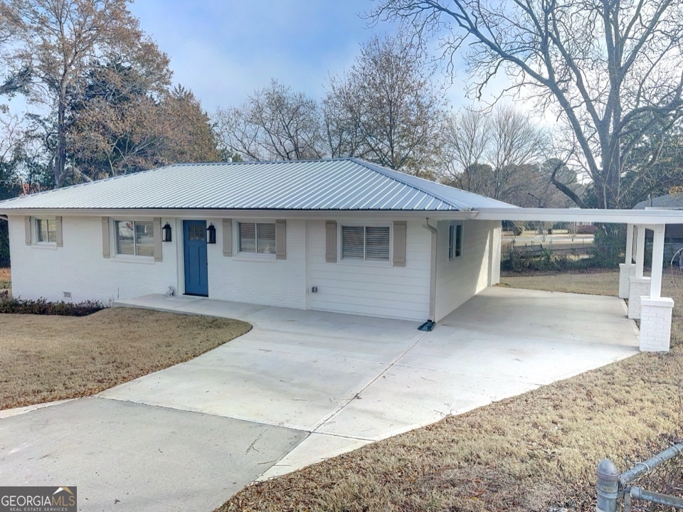 9 Lemon Street McDonough, GA 30253 - Photo 1 of 42 a house with trees in the background
