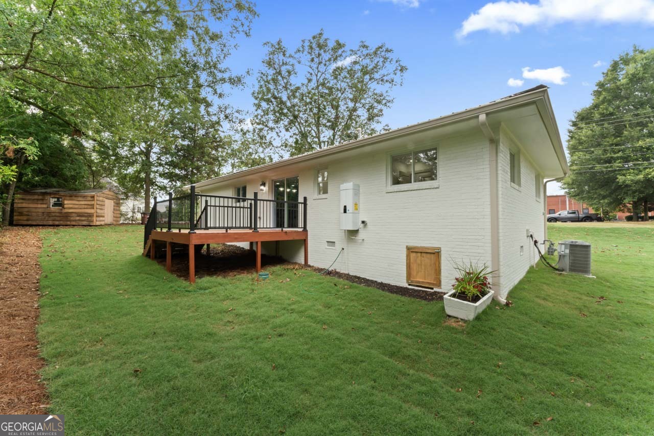 9 Lemon Street McDonough, GA 30253 - Photo 11 of 42 a view of a house with backyard