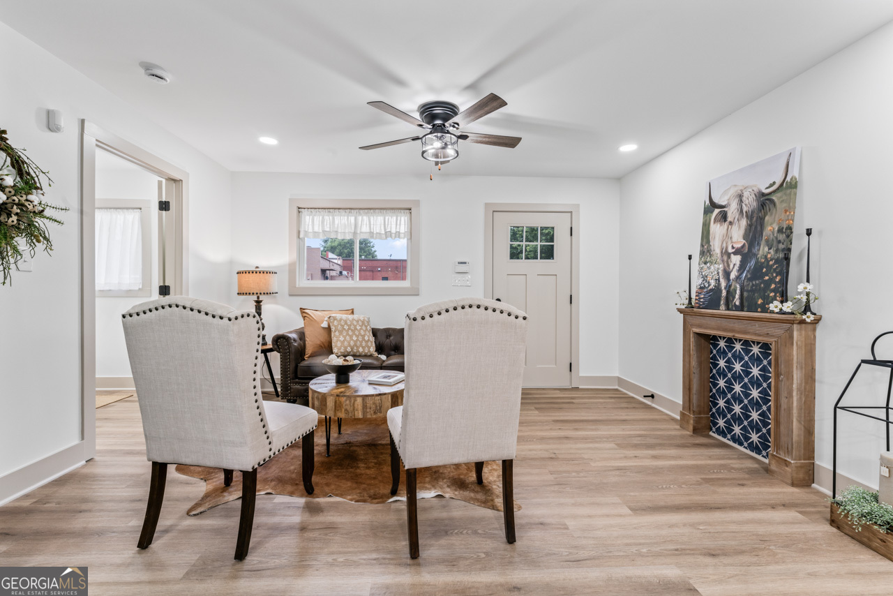 9 Lemon Street McDonough, GA 30253 - Photo 14 of 42 a view of a a dining room with furniture window and wooden floor