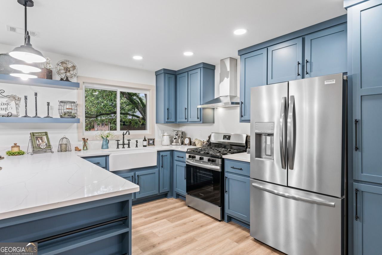 9 Lemon Street McDonough, GA 30253 - Photo 20 of 42 a kitchen with stainless steel appliances granite countertop a refrigerator a stove a sink and a refrigerator