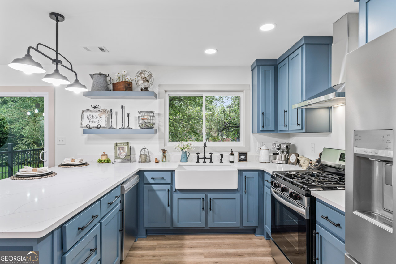 9 Lemon Street McDonough, GA 30253 - Photo 22 of 42 a kitchen with a sink stove and cabinets