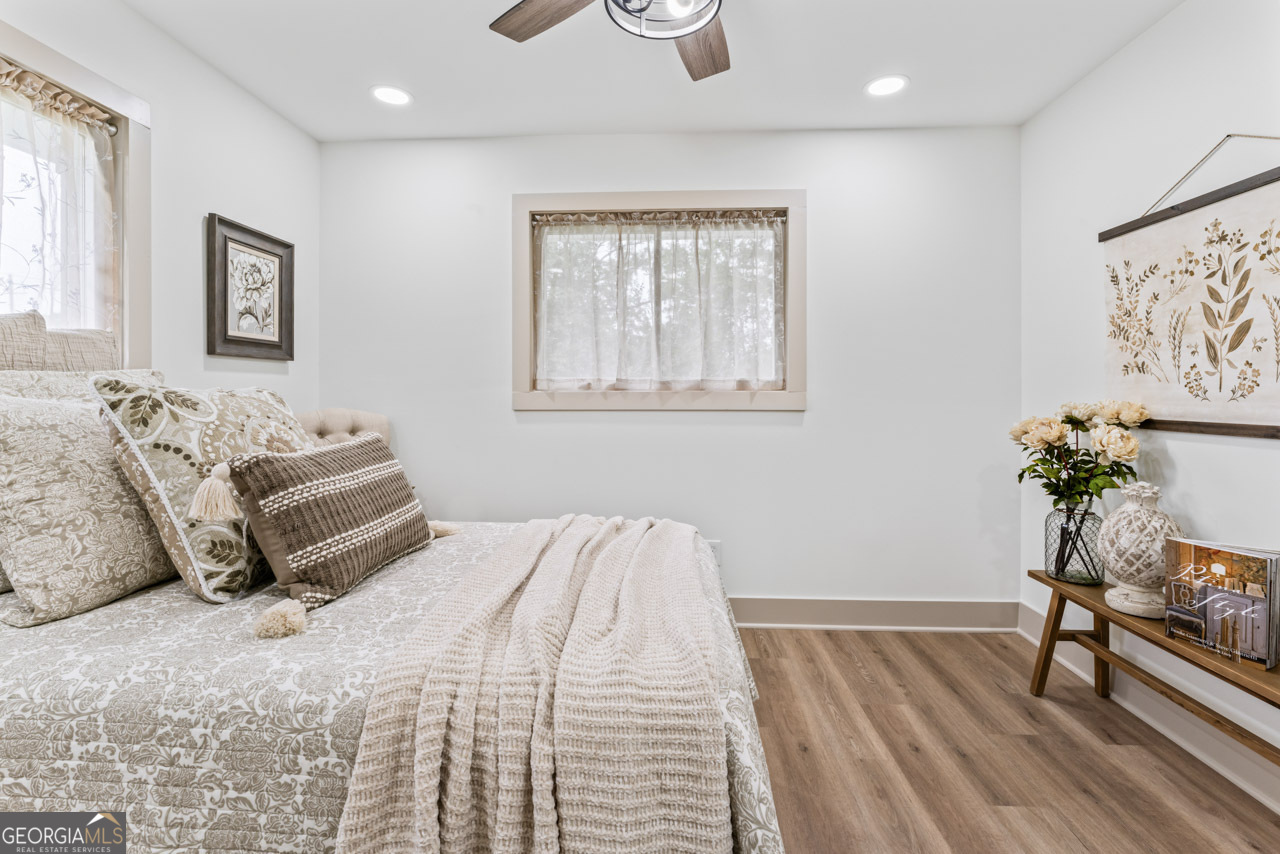 9 Lemon Street McDonough, GA 30253 - Photo 30 of 42 a bedroom with a bed and wooden floor