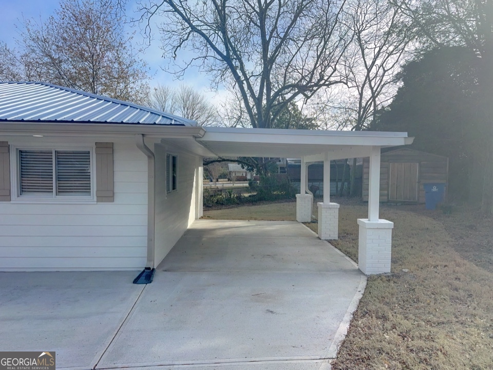 9 Lemon Street McDonough, GA 30253 - Photo 4 of 42 a view of a house with a outdoor space and balcony
