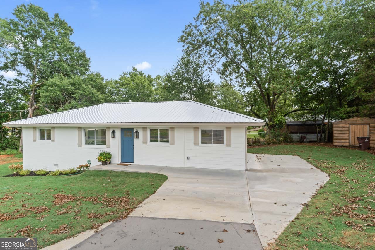 9 Lemon Street McDonough, GA 30253 - Photo 8 of 42 a view of a yard in front of a house with a large tree