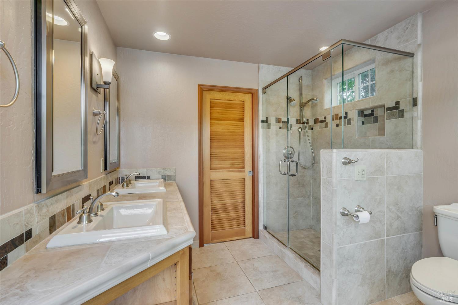 20 Rosedale Road Calistoga, CA 94515 - Photo 27 of 47 a bathroom with a granite countertop sink mirror and shower