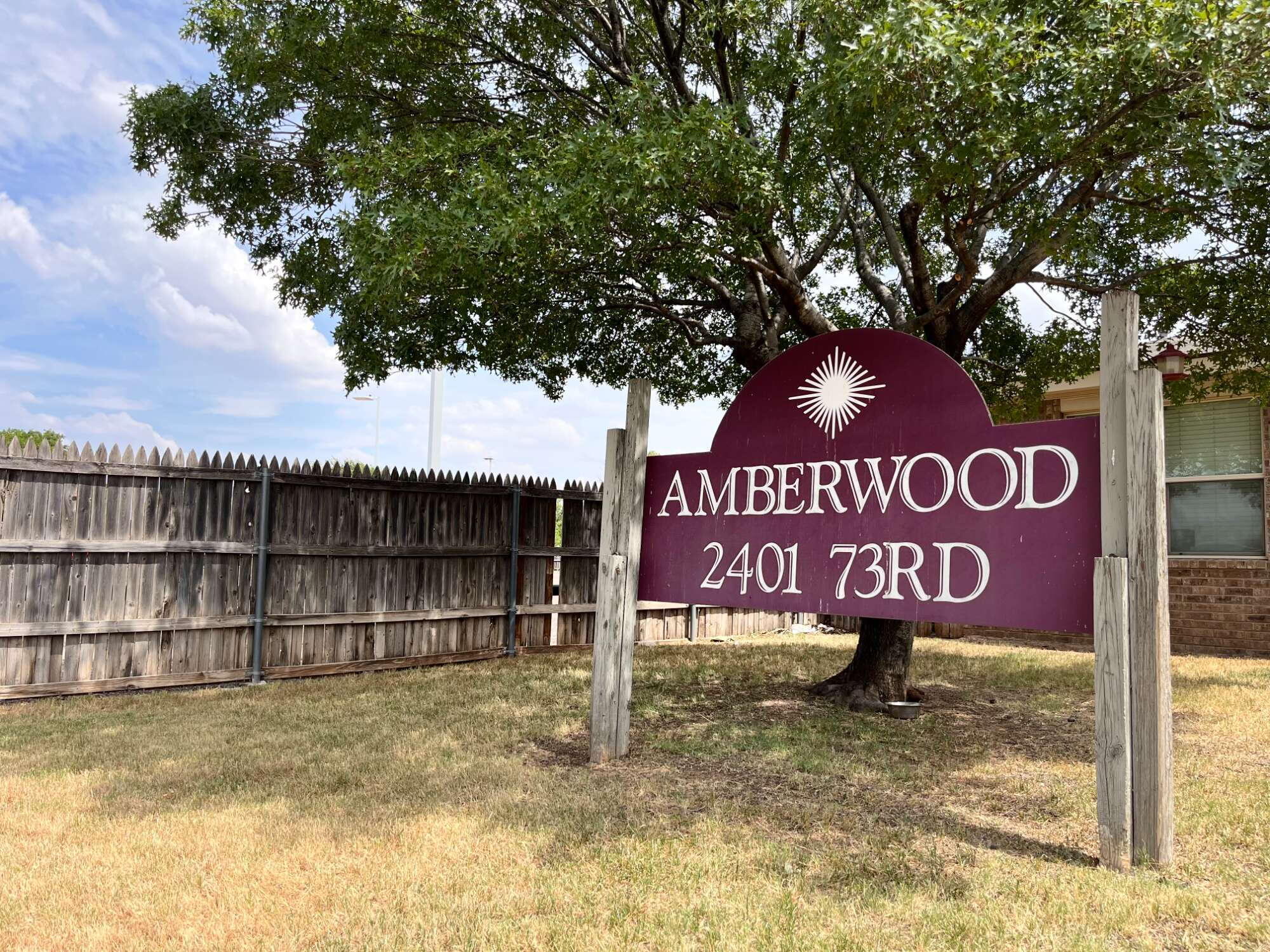 2401 73rd Street, Unit 16 Lubbock, TX 79423 - Photo 1 of 19 a street sign that is sitting on a brick wall