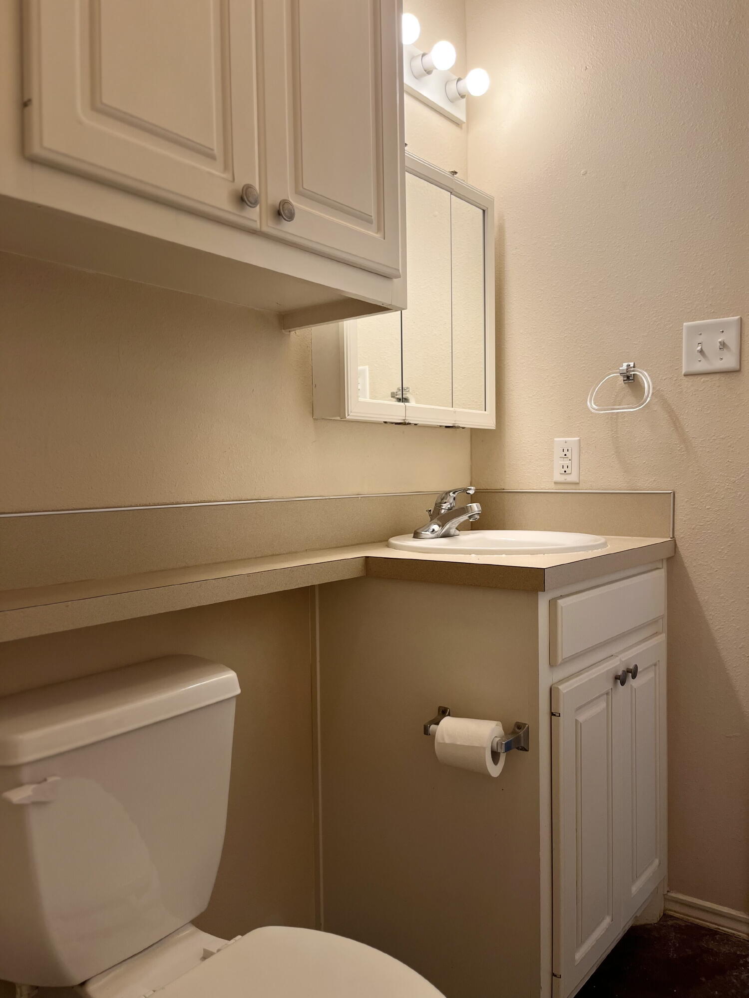 2401 73rd Street, Unit 16 Lubbock, TX 79423 - Photo 12 of 19 a bathroom with a sink a toilet and vanity