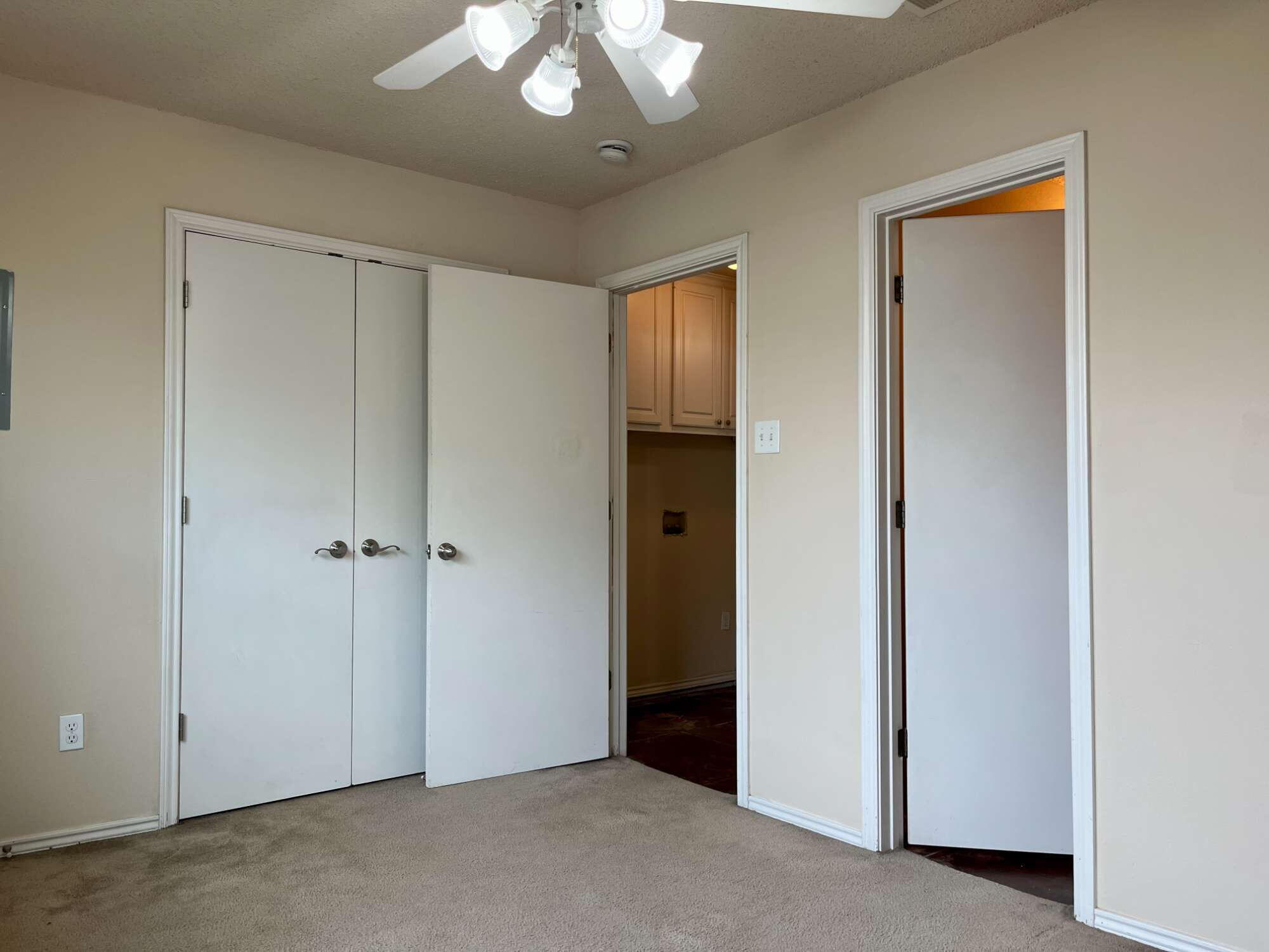 2401 73rd Street, Unit 16 Lubbock, TX 79423 - Photo 14 of 19 a view of an empty room with a window