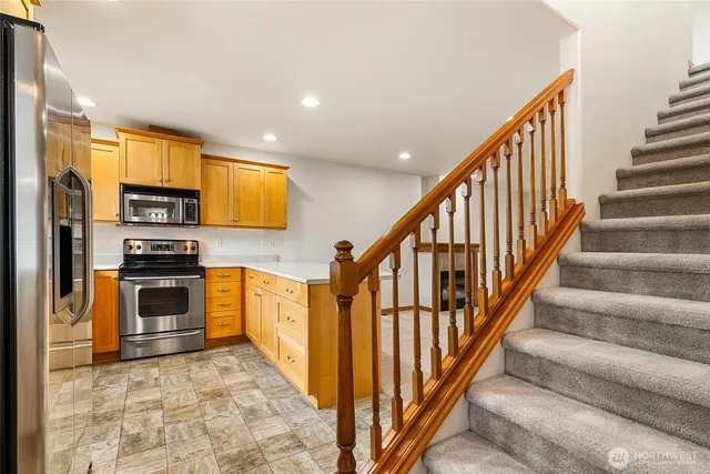 an empty room with closet and a chandelier fan