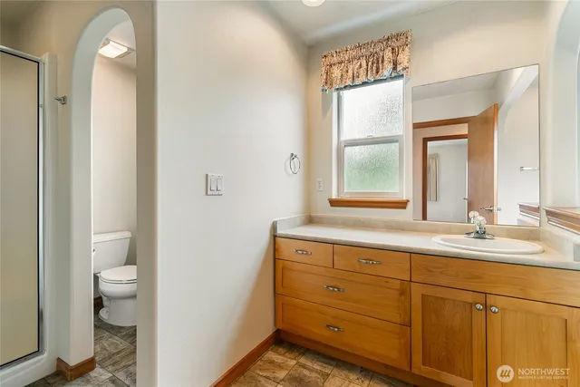 a bathroom with a glass door