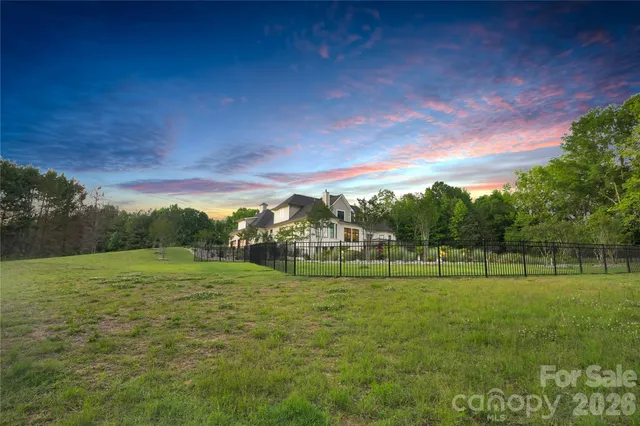 a bedroom with a large bed and a television