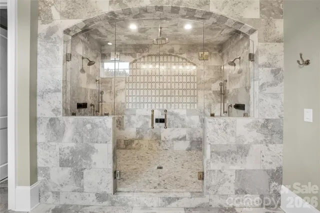 a kitchen with stainless steel appliances granite countertop a sink and a microwave