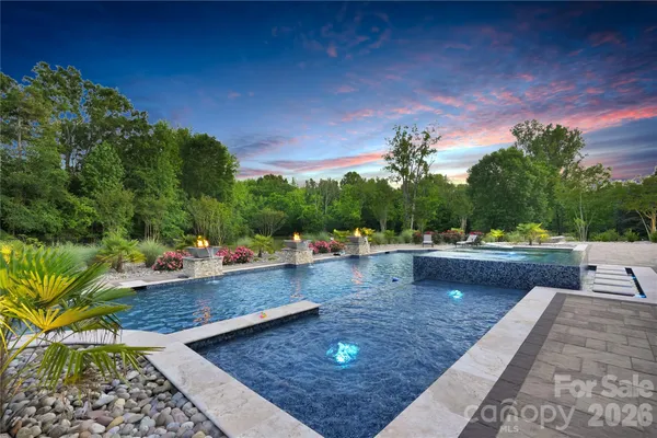 a view of a swimming pool with a patio