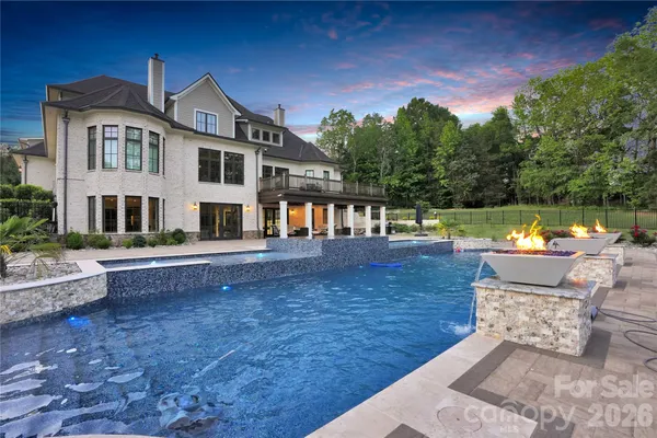 a view of a house with backyard porch and sitting area