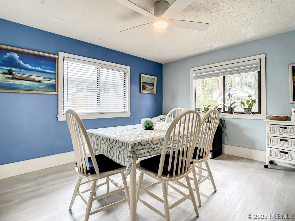208 Crawford Road New Smyrna Beach, FL 32169 - Photo 17 of 26 a view of a dining room with furniture window and outside view