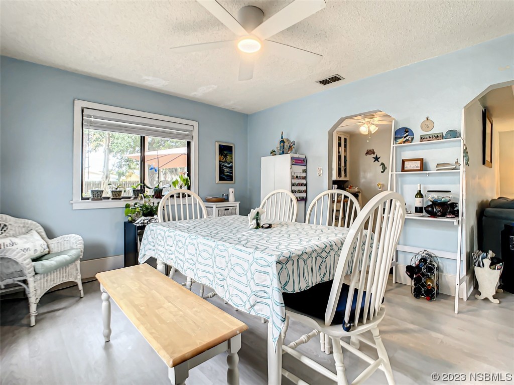 208 Crawford Road New Smyrna Beach, FL 32169 - Photo 18 of 26 a view of a dining room with furniture
