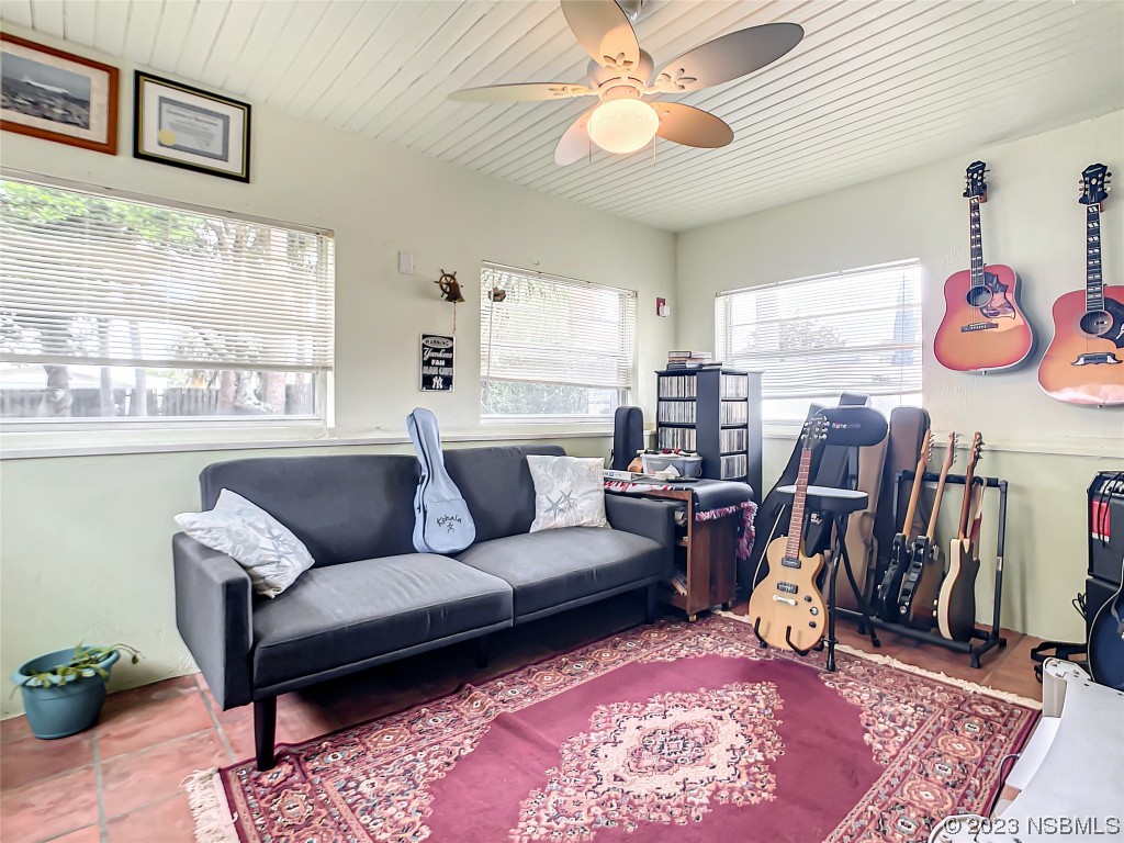208 Crawford Road New Smyrna Beach, FL 32169 - Photo 19 of 26 a living room with furniture and a rug