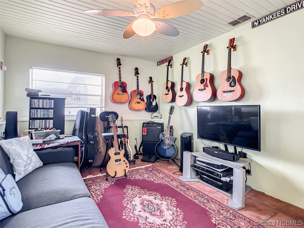 208 Crawford Road New Smyrna Beach, FL 32169 - Photo 20 of 26 a view of a room with furniture and air hockey table
