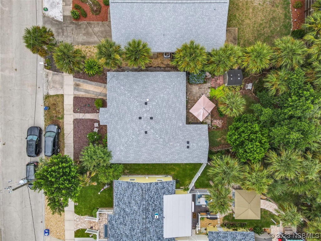 208 Crawford Road New Smyrna Beach, FL 32169 - Photo 3 of 26 an aerial view of a house with a yard and garden