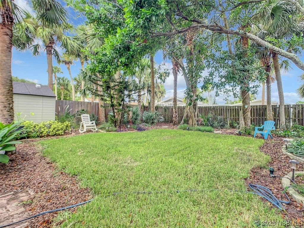 208 Crawford Road New Smyrna Beach, FL 32169 - Photo 5 of 26 a view of a yard with a tree