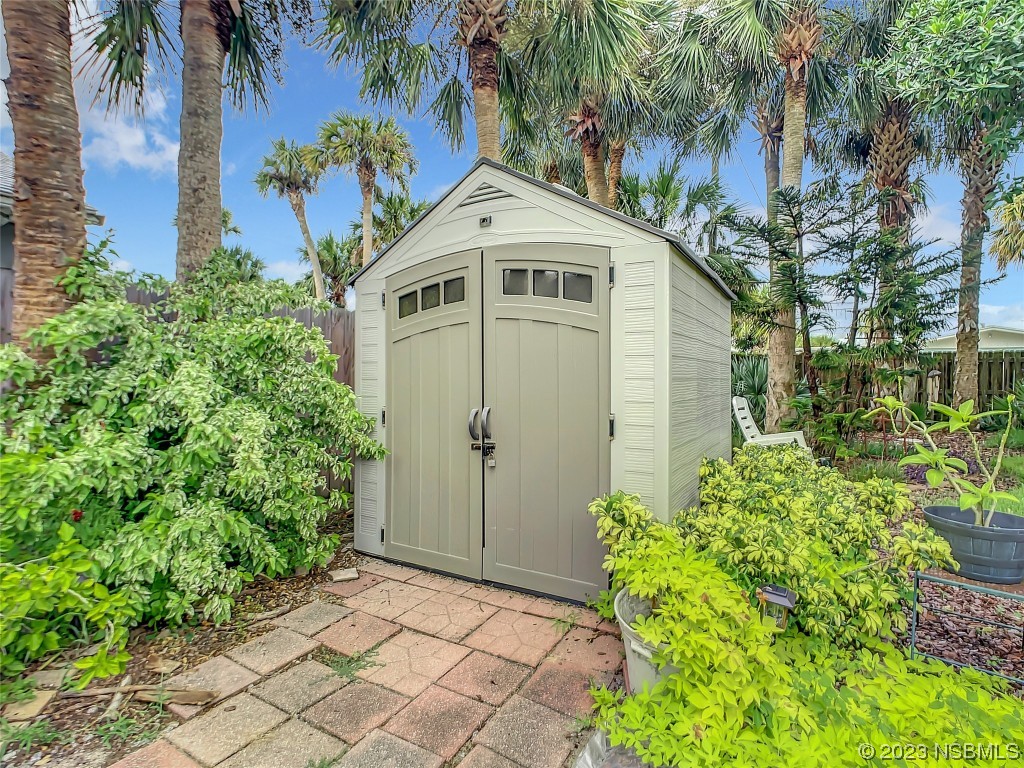 208 Crawford Road New Smyrna Beach, FL 32169 - Photo 8 of 26 a front view of a house with a yard