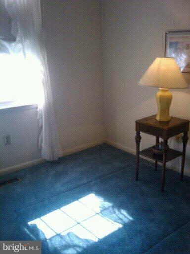 6473 Rockshire Court Alexandria, VA 22315 - Photo 1 of 12 a view of a workspace room with wooden floor and chair