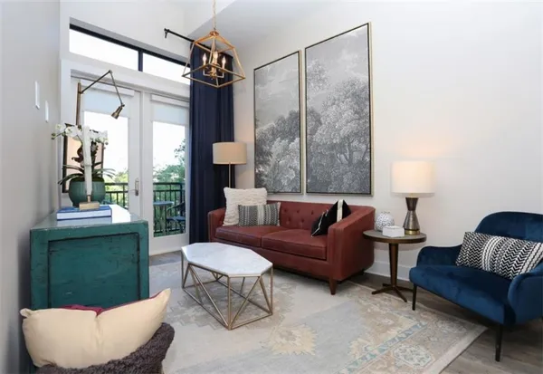 a bathroom with a granite countertop toilet sink and mirror