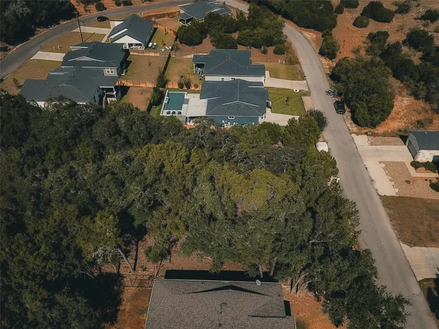 an aerial view of residential house with outdoor space
