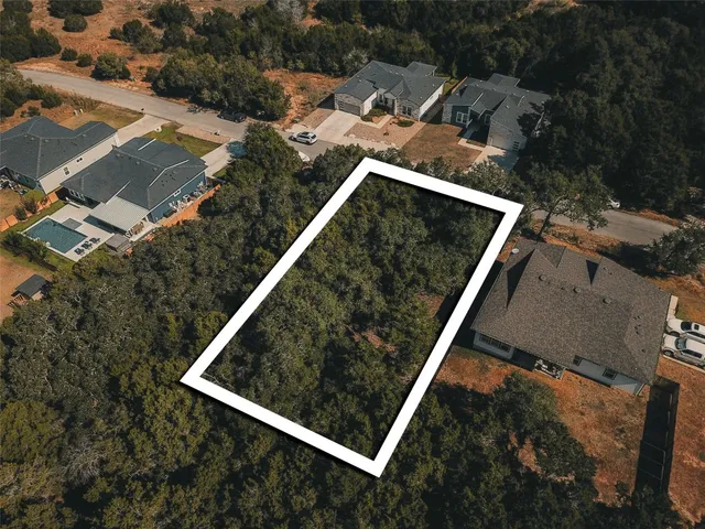 an aerial view of residential house with outdoor space