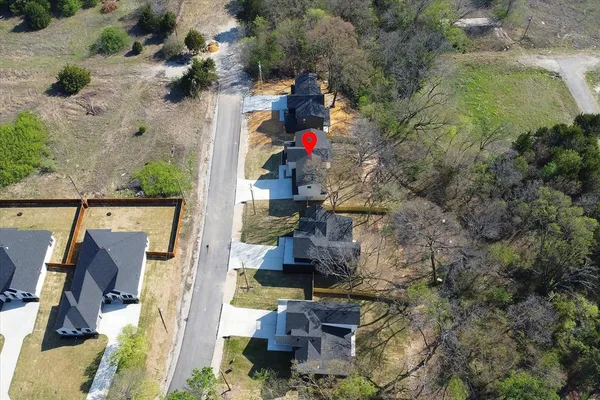 an aerial view of houses with outdoor space