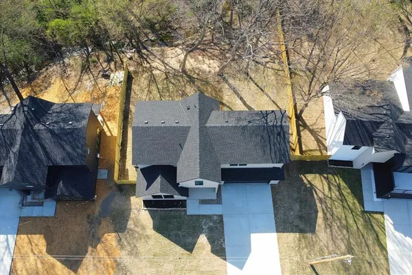 a view of a patio with furniture and a fire pit