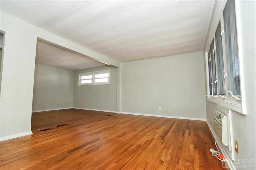 59 Willow Road Metuchen, NJ 08840 - Photo 8 of 23 wooden floor in an empty room with a window