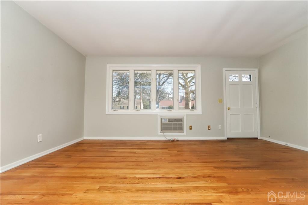 59 Willow Road Metuchen, NJ 08840 - Photo 9 of 23 a view of empty room with wooden floor and fan