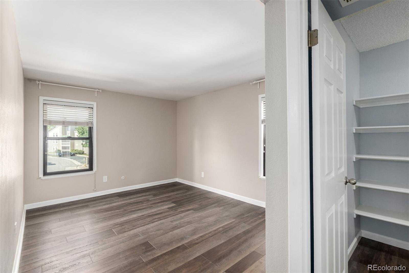 4896 South Dudley Street, Unit 910 Littleton, CO 80123 - Photo 15 of 30 a view of empty room with wooden floor and fan