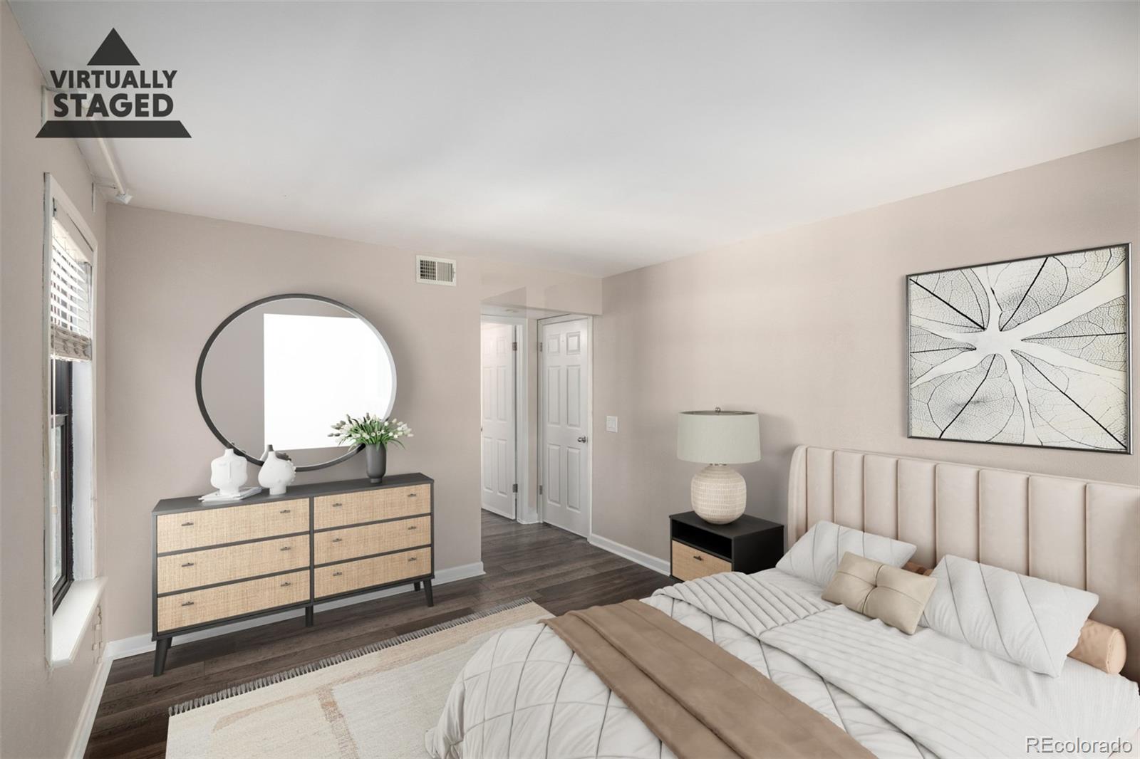 4896 South Dudley Street, Unit 910 Littleton, CO 80123 - Photo 16 of 30 a bedroom with a bed and a painting on the wall