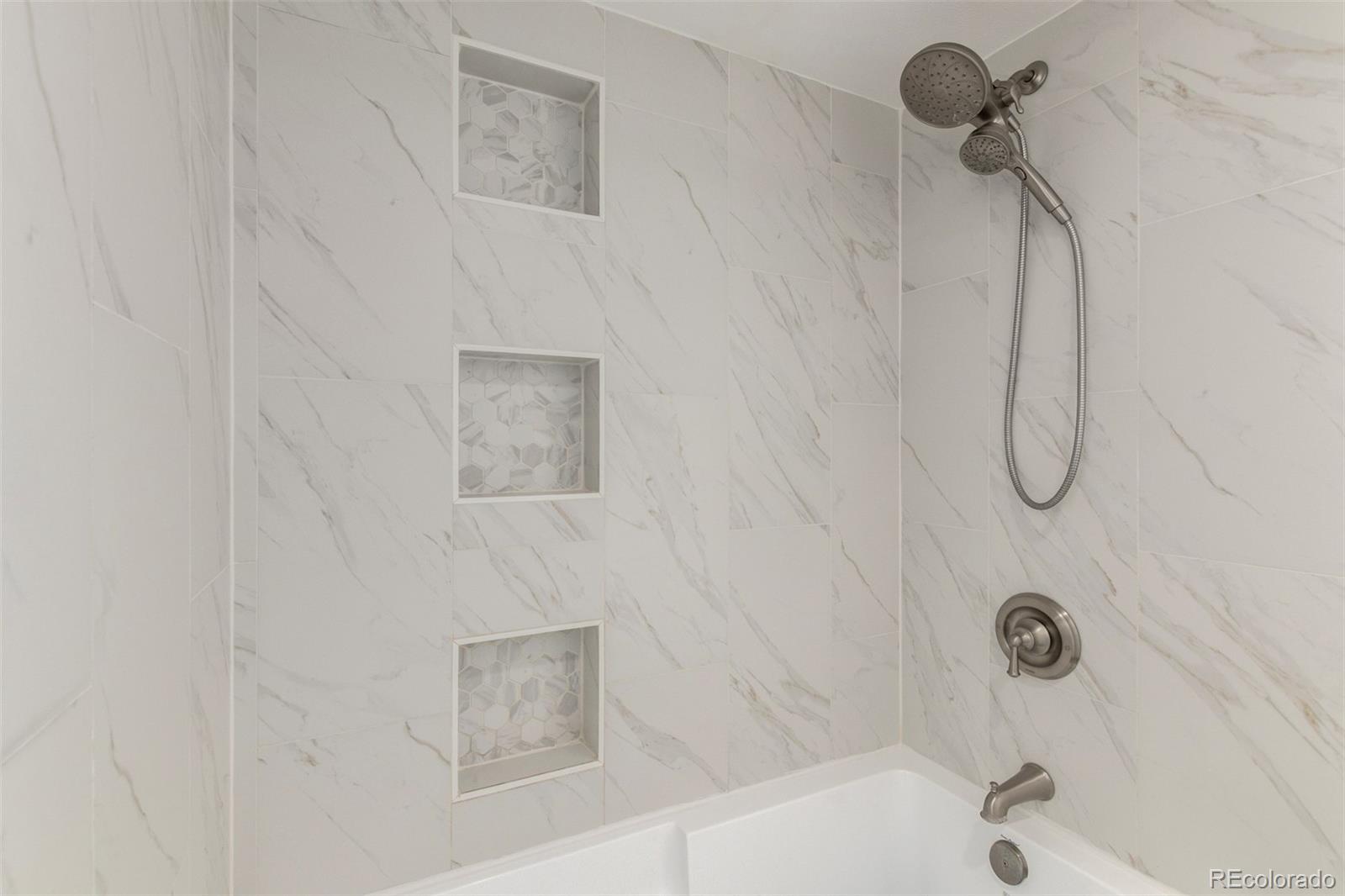 4896 South Dudley Street, Unit 910 Littleton, CO 80123 - Photo 20 of 30 a bathroom with a shower