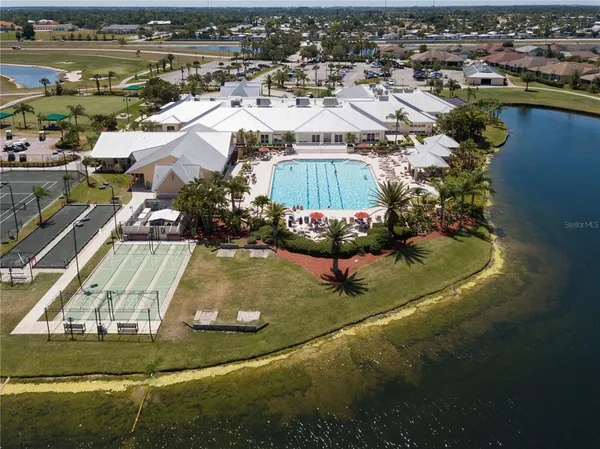 an aerial view of a house with a swimming pool yard and outdoor seating