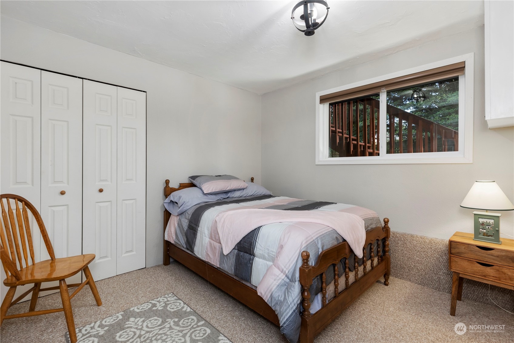 120 221st Street Southwest Bothell, WA 98021 - Photo 29 of 40 a bedroom with a bed chair and window