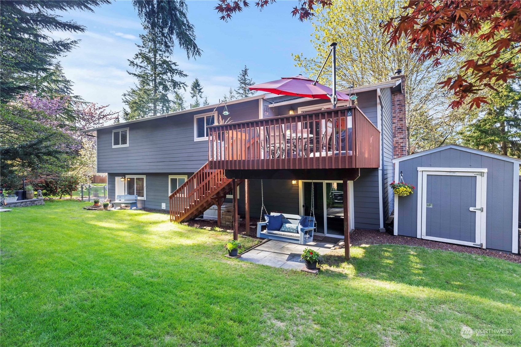 120 221st Street Southwest Bothell, WA 98021 - Photo 36 of 40 a view of a house with a yard patio and fire pit