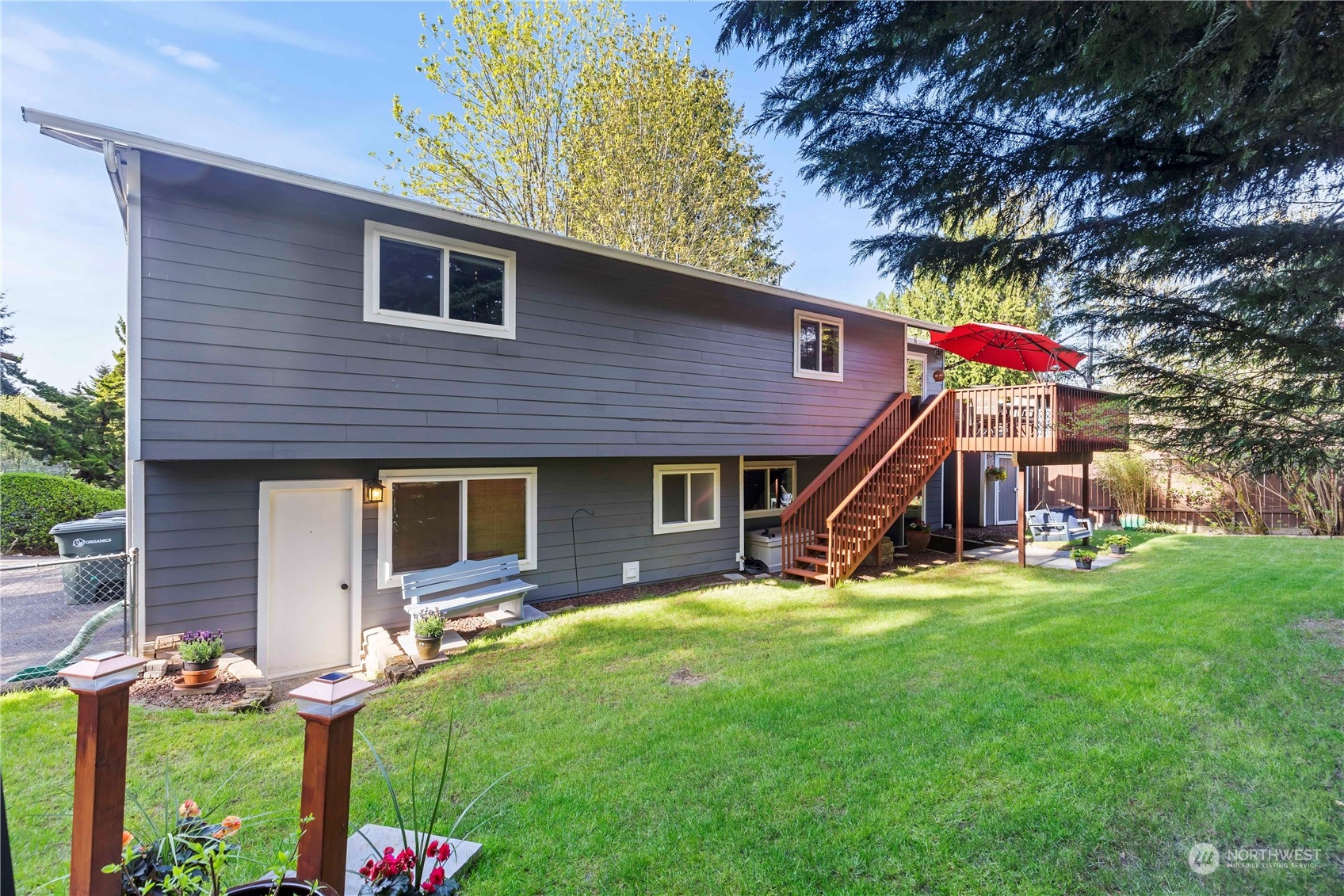 120 221st Street Southwest Bothell, WA 98021 - Photo 37 of 40 a view of a house with a yard patio and a garden