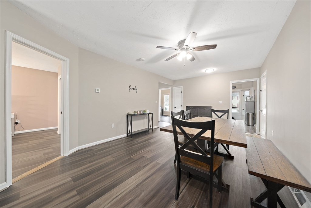 22 Union Square, Unit 22 Randolph, MA 02368 - Photo 16 of 28 a view of a dining room with furniture and wooden floor