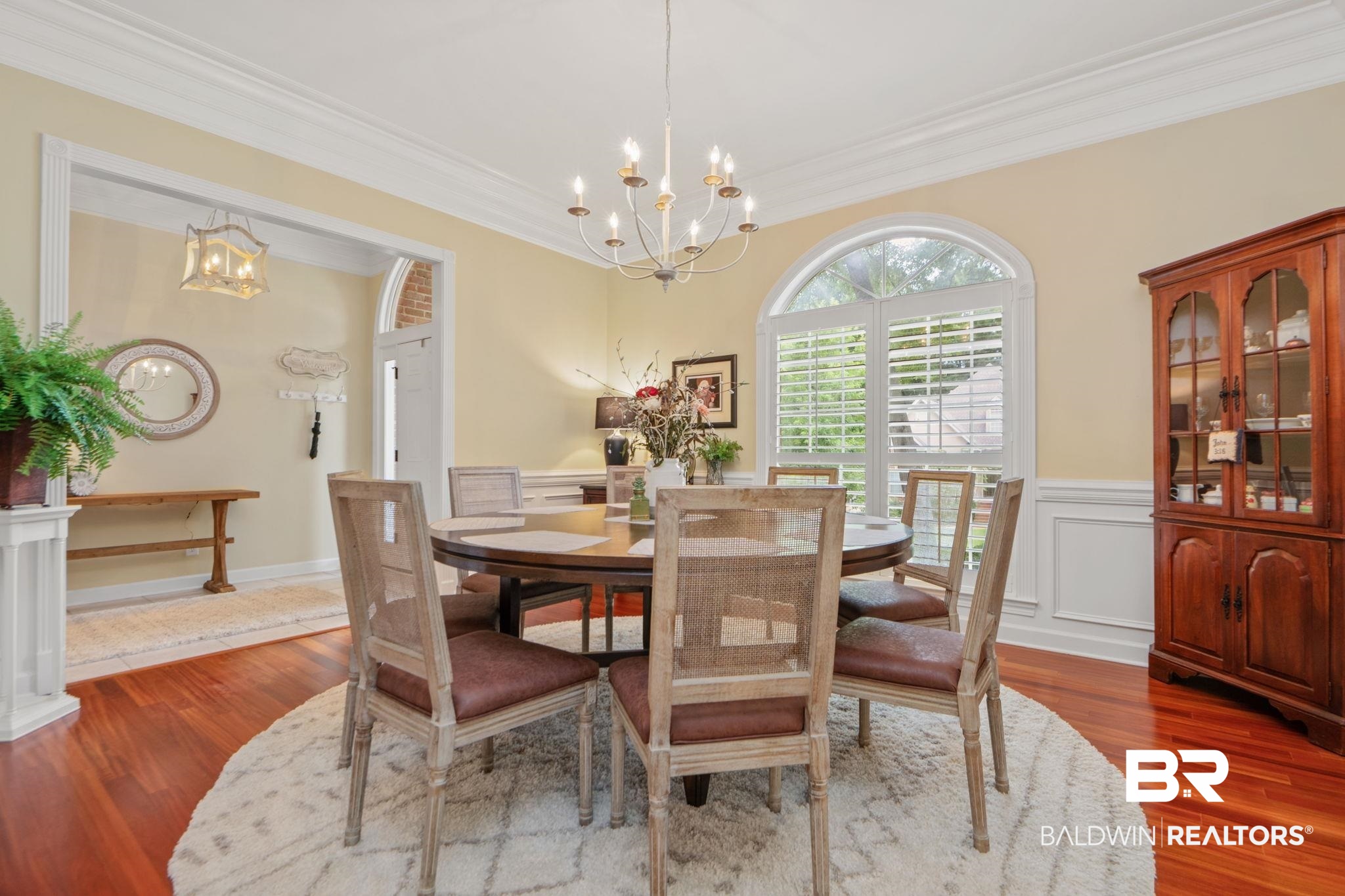 105 Beaver Dam Road Fairhope, AL 36532 - Photo 12 of 55 Dining area with dark hardwood / wood-style flooring, a notable chandelier, and ornamental molding