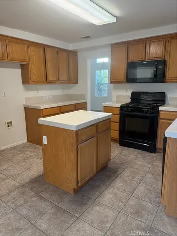 a kitchen with a cabinets and steel appliances