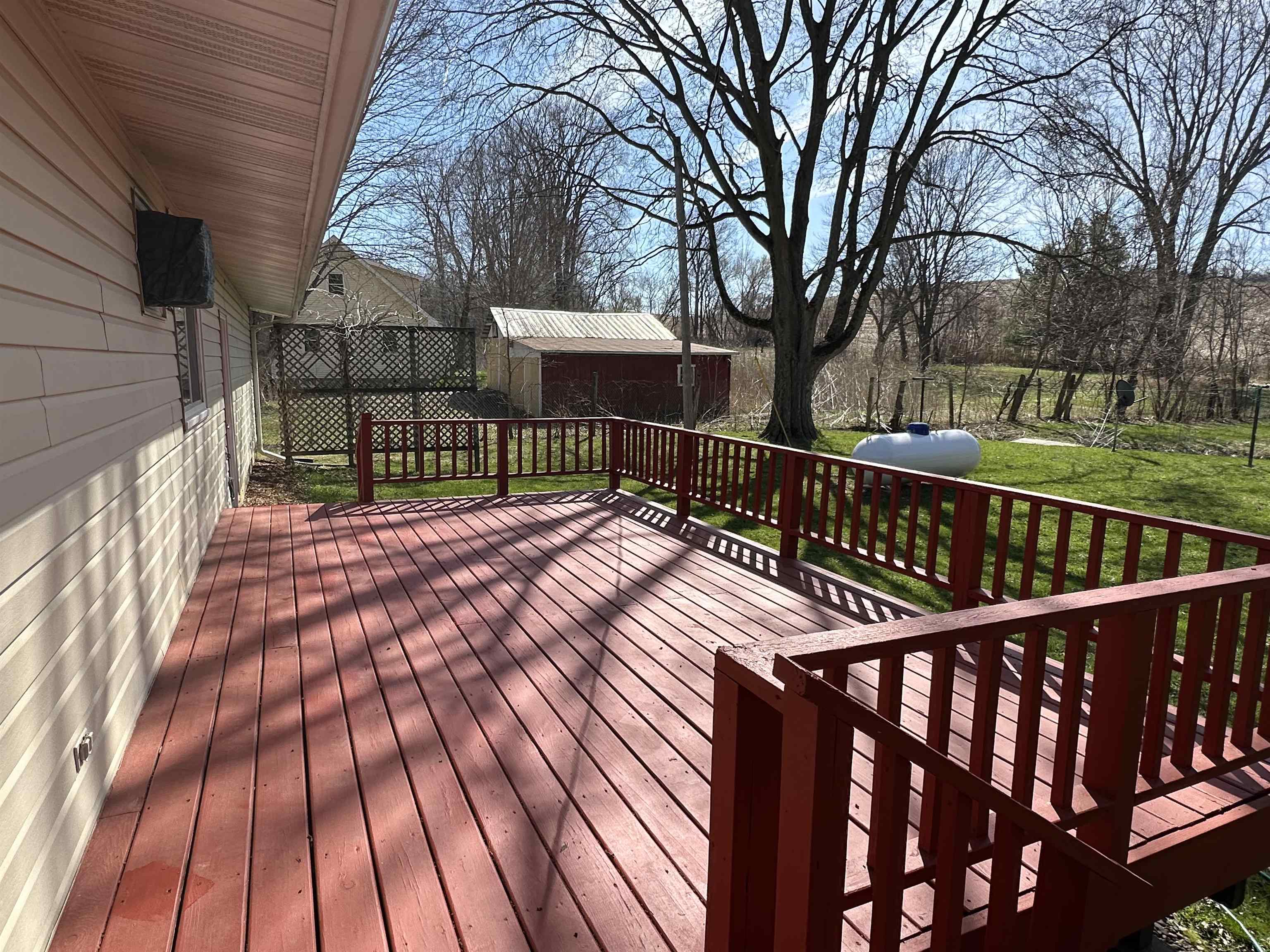 14400-3 3 Mile Road Savanna, IL 61074 - Photo 11 of 19 a balcony with wooden floor and trees