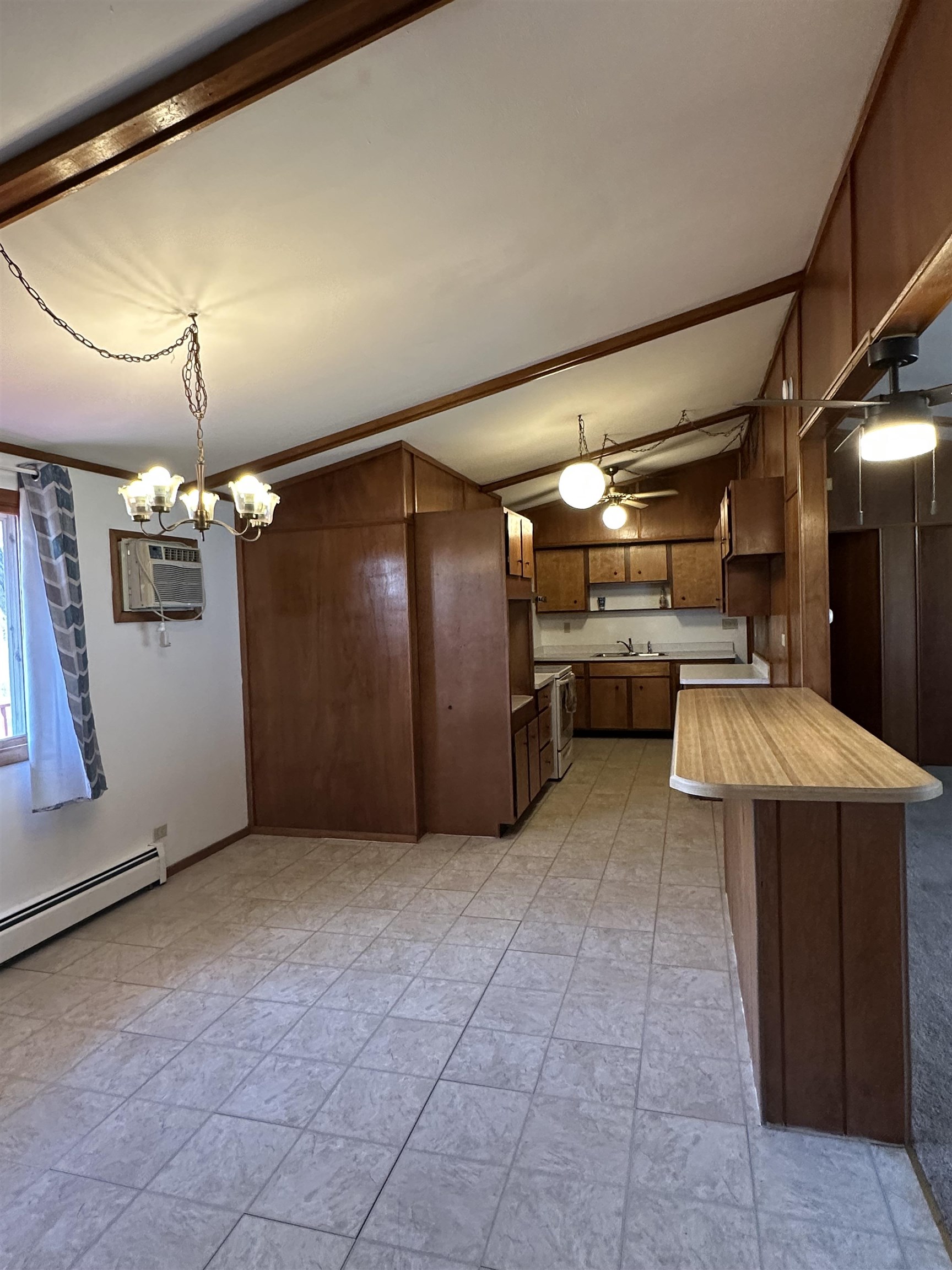 14400-3 3 Mile Road Savanna, IL 61074 - Photo 4 of 19 a view of a refrigerator in kitchen and utility room