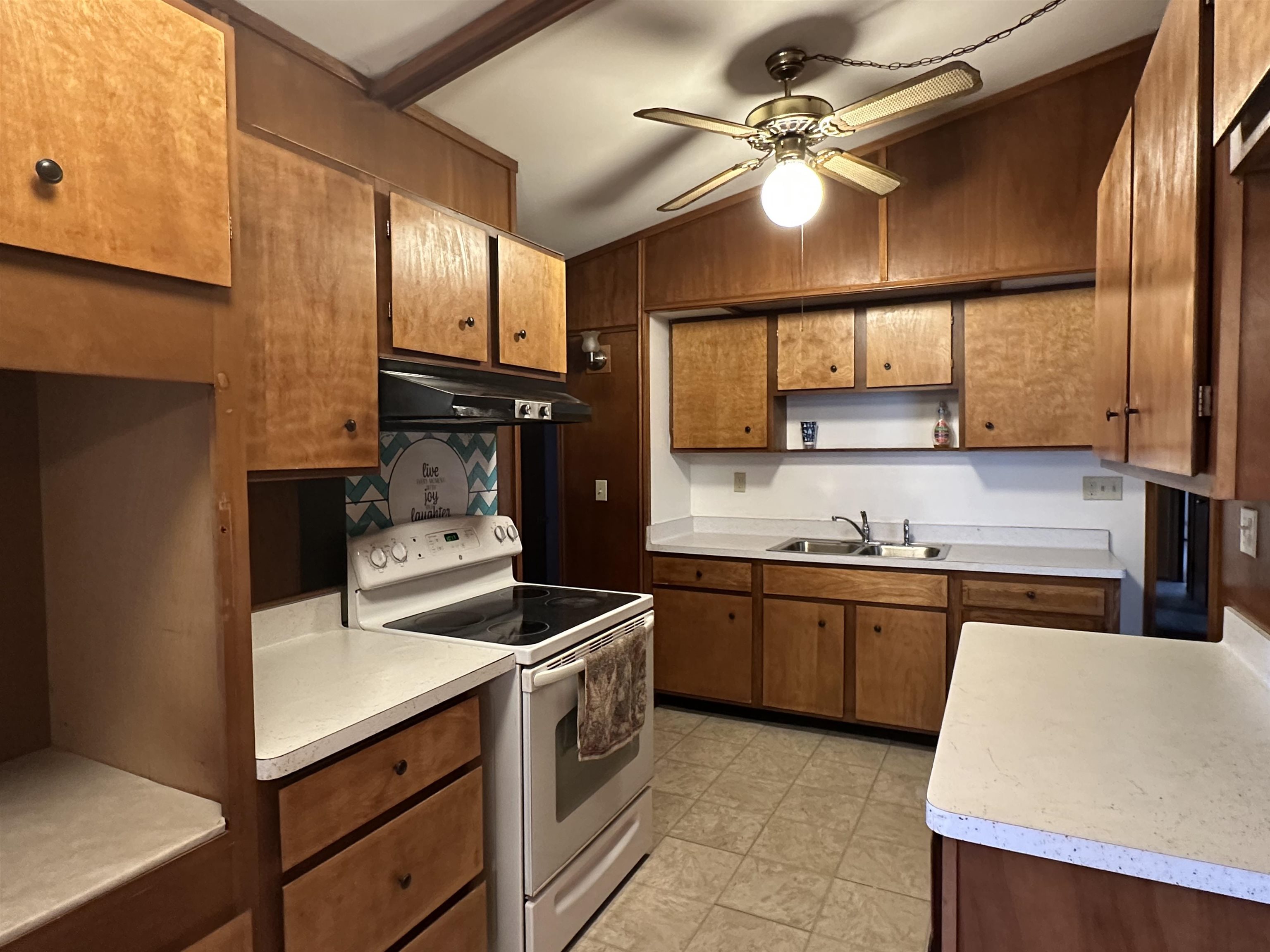 14400-3 3 Mile Road Savanna, IL 61074 - Photo 5 of 19 a kitchen with stainless steel appliances granite countertop a sink a stove and a refrigerator