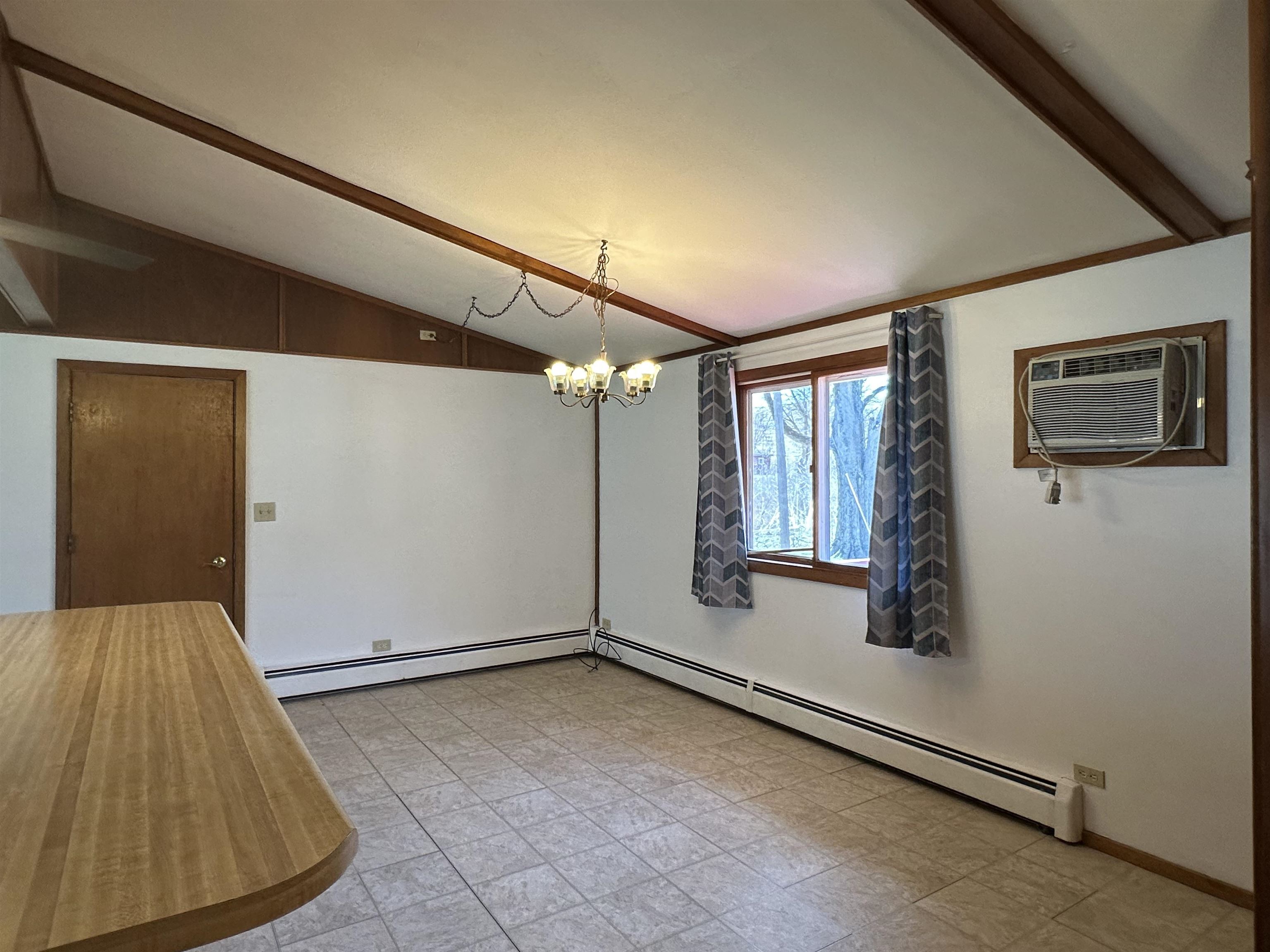 14400-3 3 Mile Road Savanna, IL 61074 - Photo 6 of 19 a view of a livingroom with wooden floor and windows