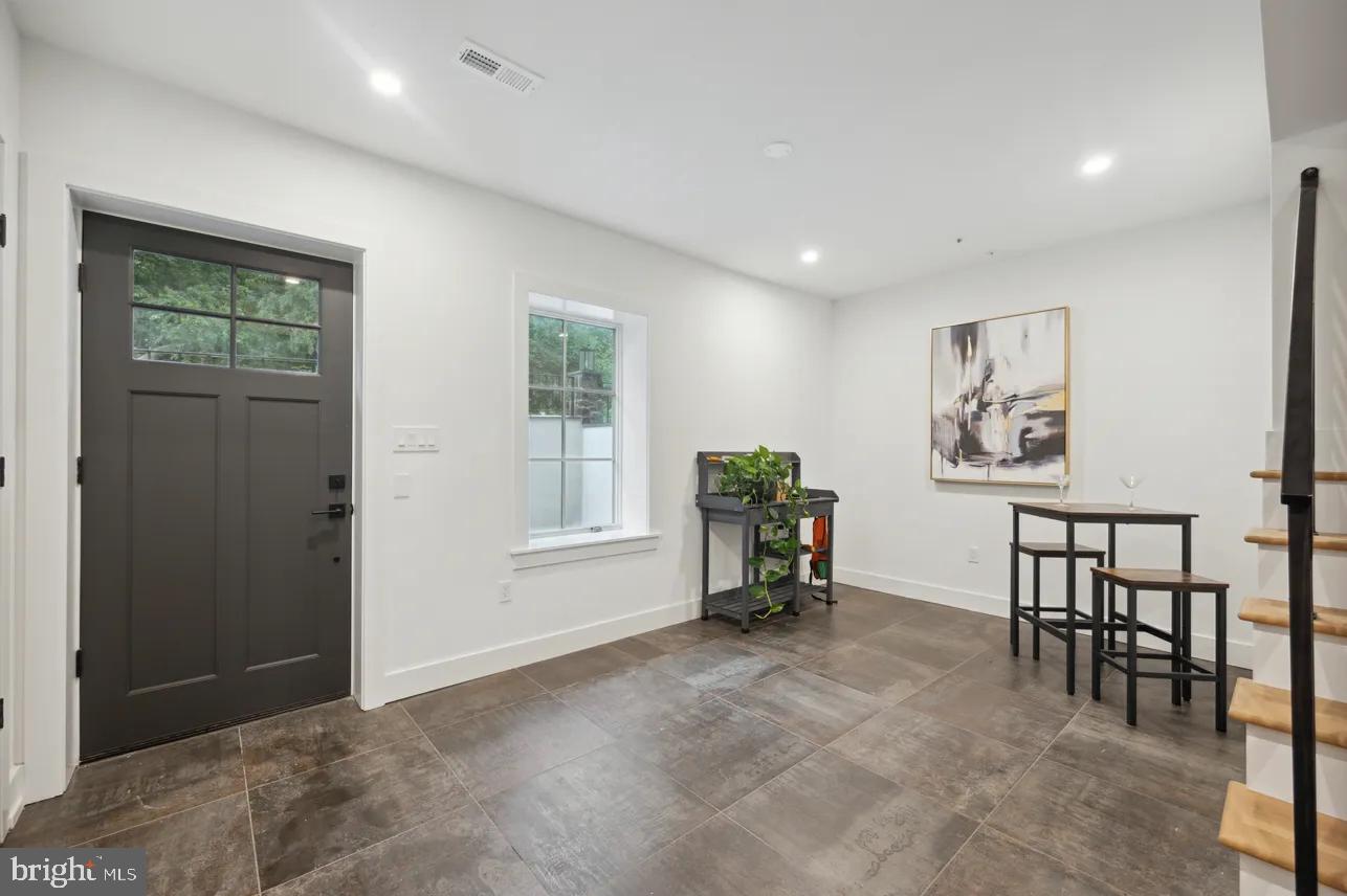 8201 Shawnee Street Philadelphia, PA 19118 - Photo 2 of 22 a view of workspace with furniture and window