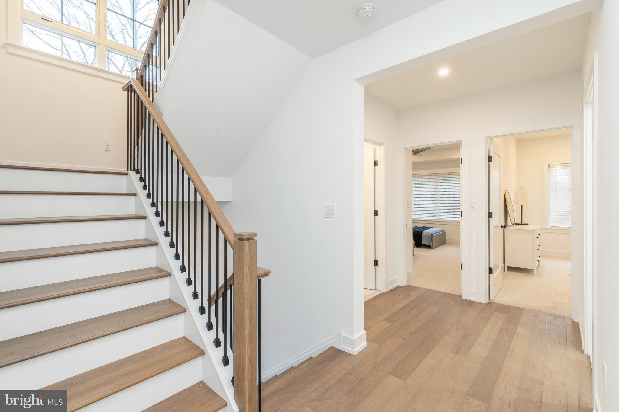 8201 Shawnee Street Philadelphia, PA 19118 - Photo 5 of 22 a view of a hallway with wooden floor and staircase