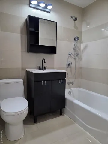 a bathroom with a sink a toilet and a bathtub